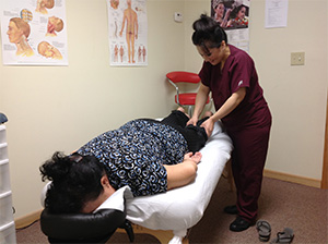 Hmong patient receiving theraputic massage